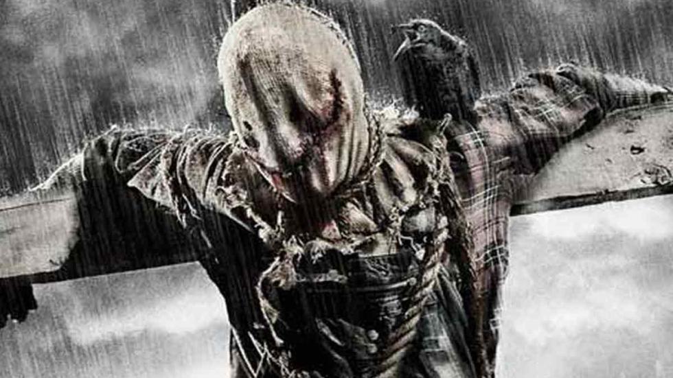 Husk creepy scarecrow with a crow on its shoulder