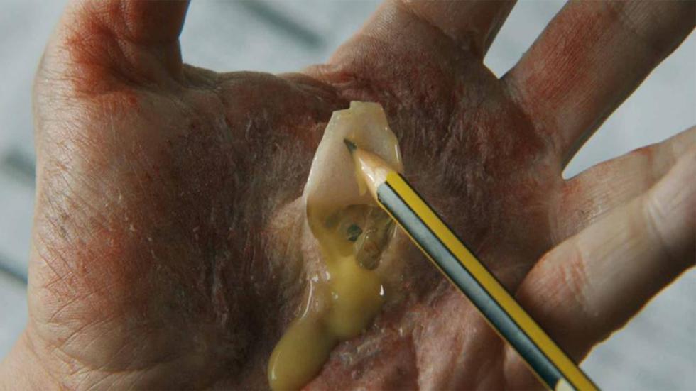 I Am the Doorway film still pencil in a scab exposes an eye