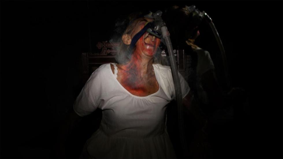 Isolation film still of woman screaming