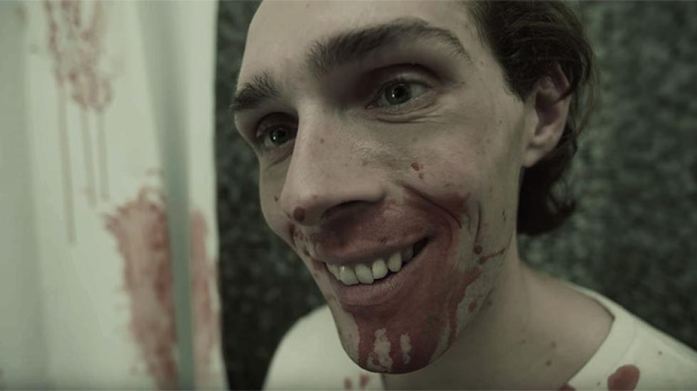  It's a Boy film still man smiling with bloody mouth