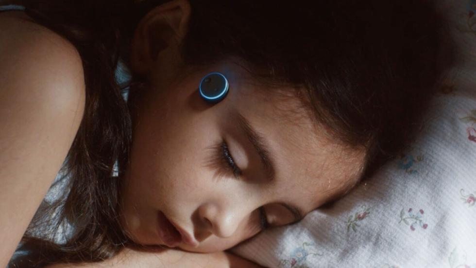 KEPT film still little girl with head probes sleeping