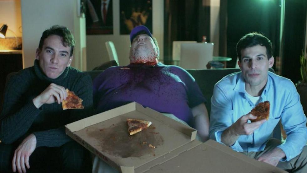 Killer Date film still dead man, playing video games and eating pizza.