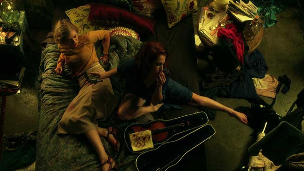 The Labyrinth two women sitting on a bed
