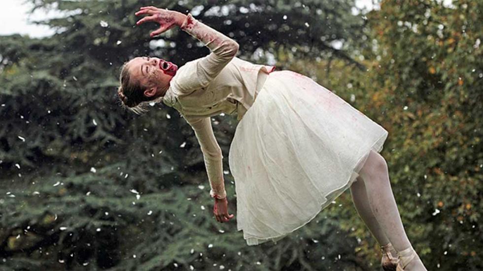 Livid bloody mouthed woman floats on her back in the air