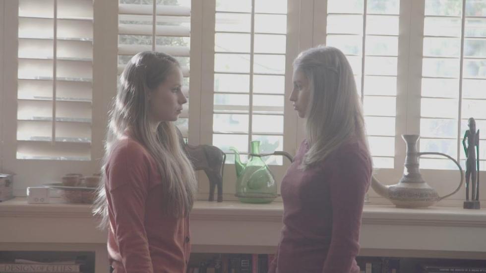 The Perfect Family film still two young women talking to each other.