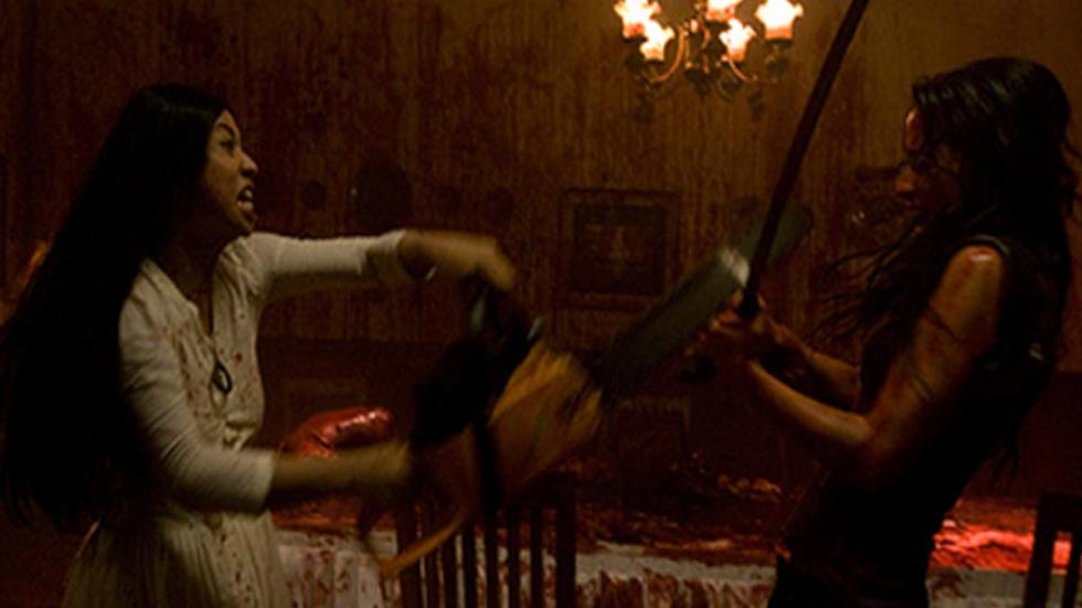 Macabre two bloodied women fight