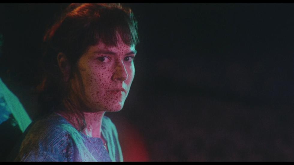 Macabre film still bloody faced woman staring