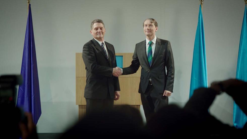 Hand in Hand film still two politicians shaking hands