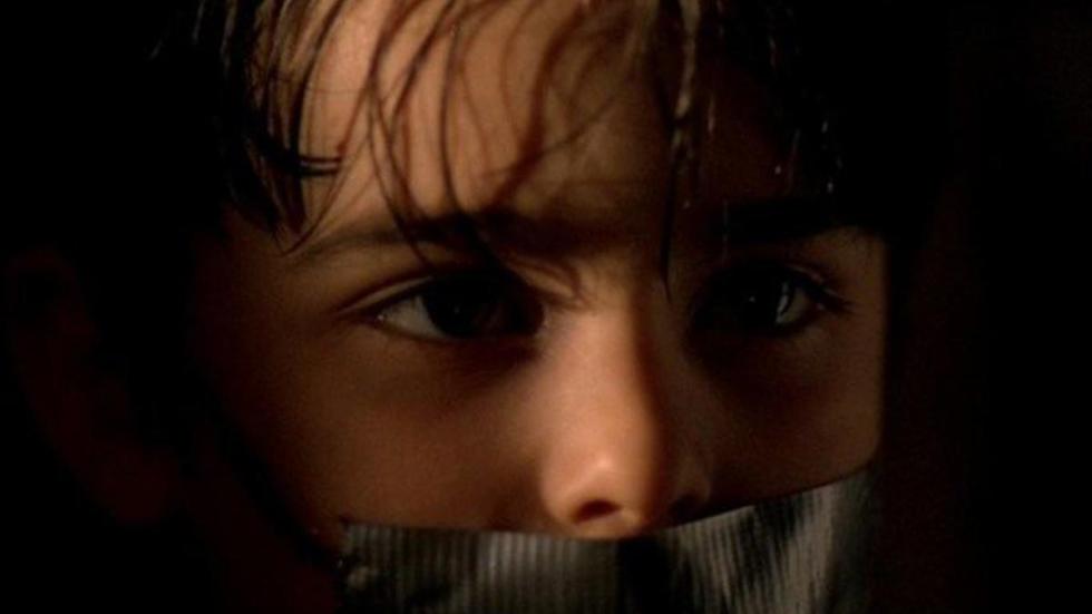 Malevolence boy with duct tape over his mouth