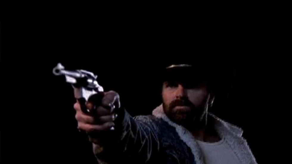 Missing man points a gun at something