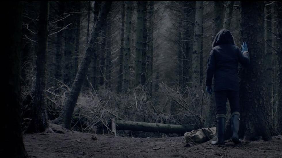 nsfw film still man looking for something in the woods