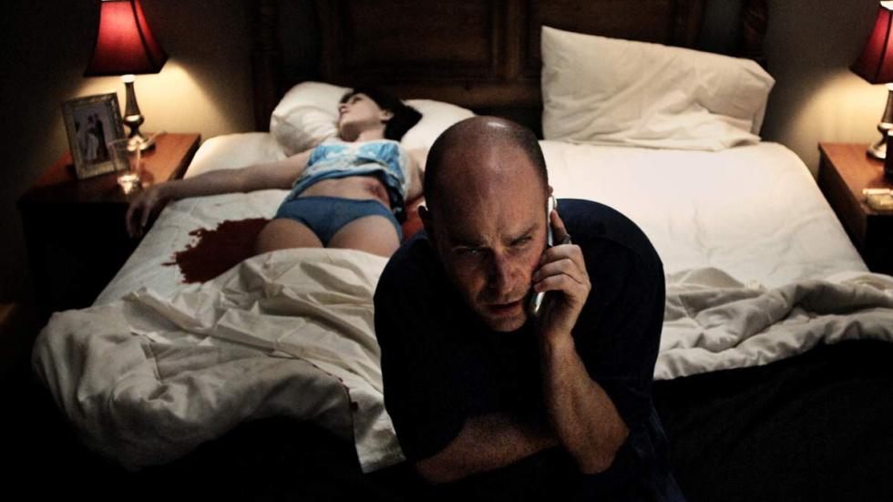 Obits man talks on the phone with dead bleeding woman laying on the bed