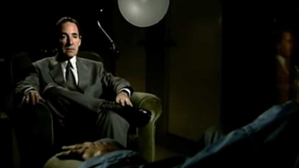 Out There man sits in a chair