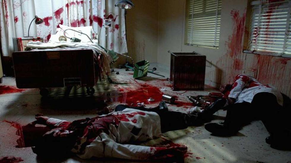 Parasomnia bloodied man lays on the floor of a bloody room