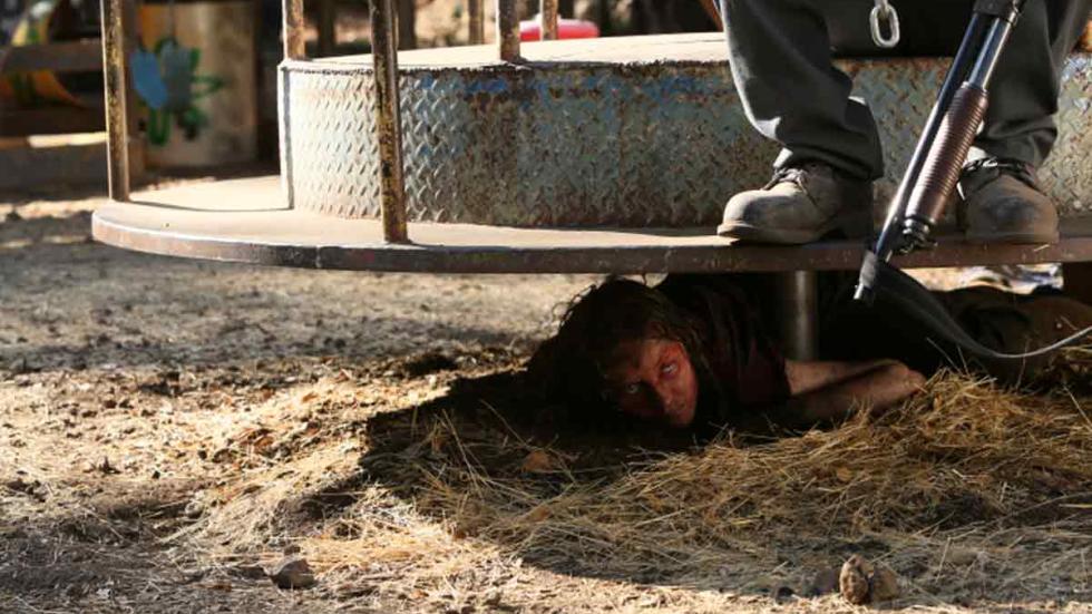 Preservation person hides under playground spin toy