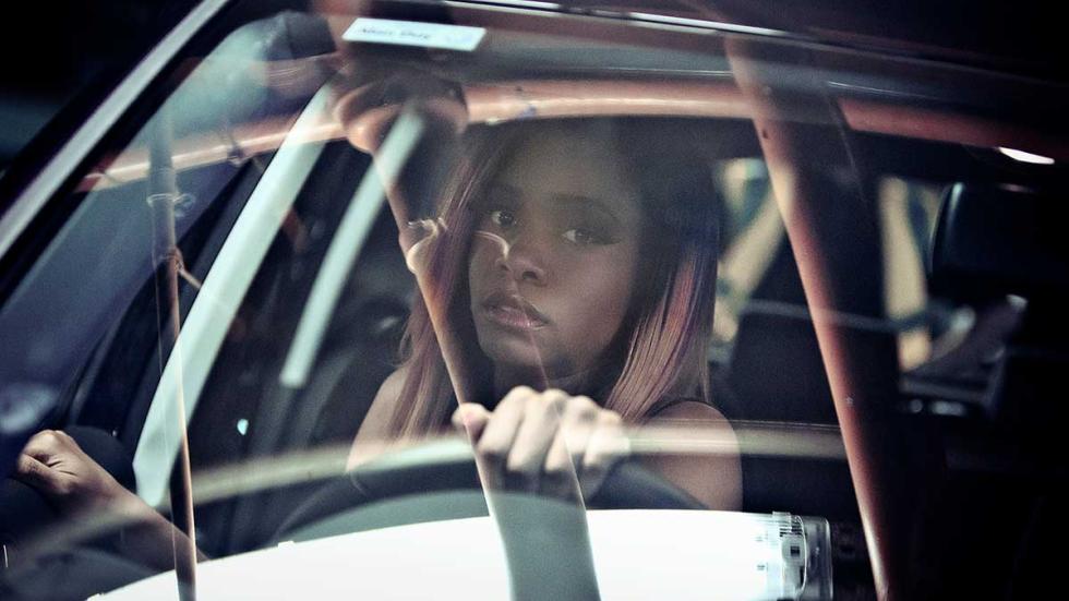 Prey film still woman drives a car