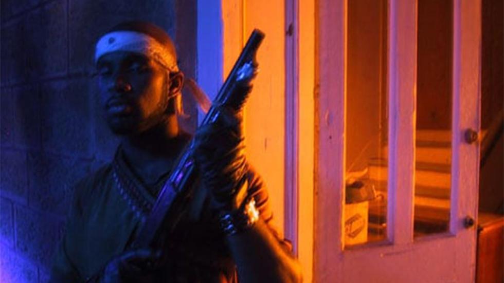 The Quick And The Undead man holds rifle
