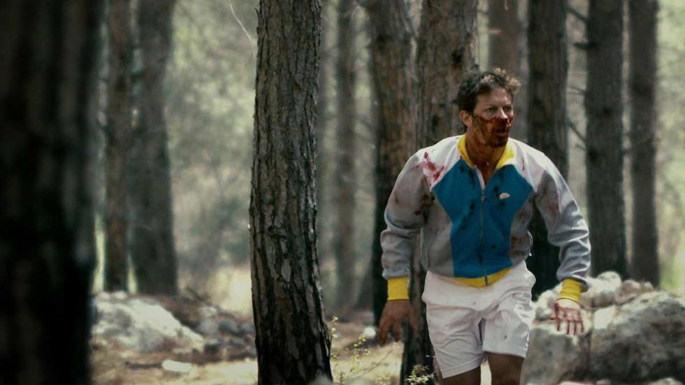 Kalevet (Rabies) A bloody man runs through the forest