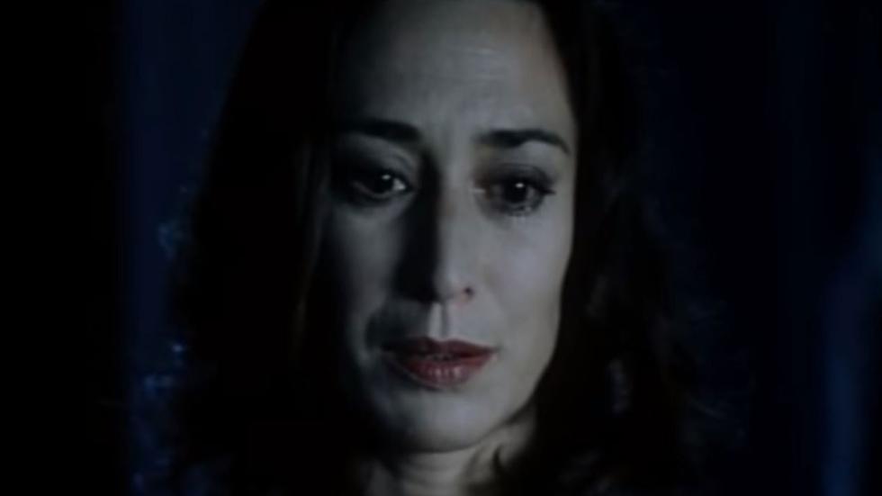 R.I.P. woman looks on