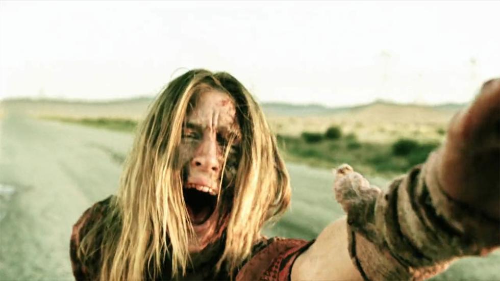 Savaged woman screams while reaching out