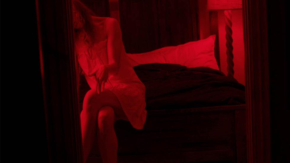 She Forgives film still woman sitting on a bed
