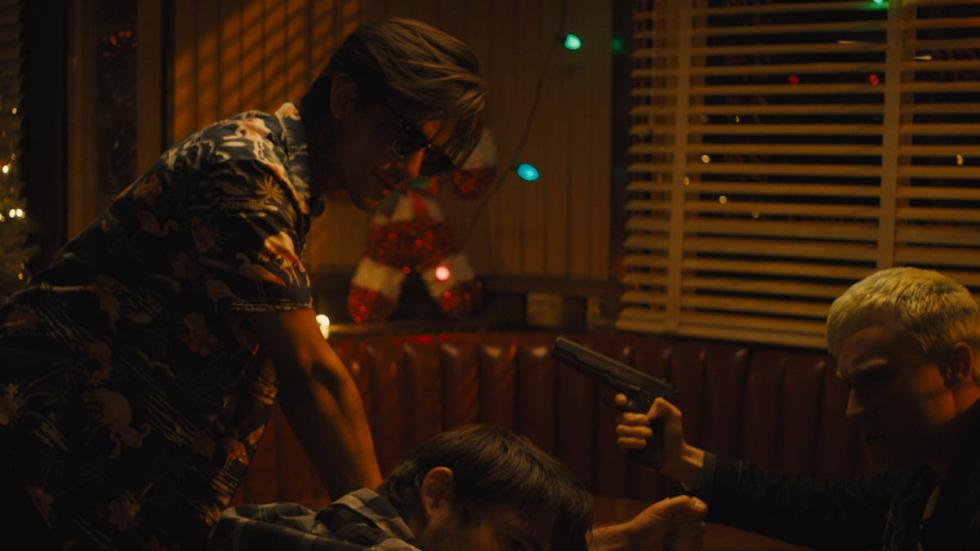 Shallow Graves film still man pulls gun on other man