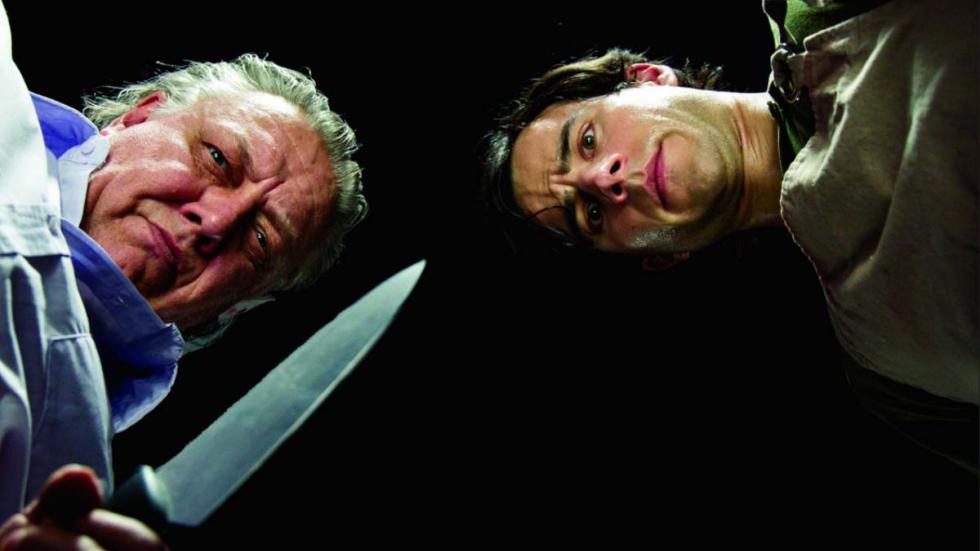 Cold Feet two men one with a knife looking down