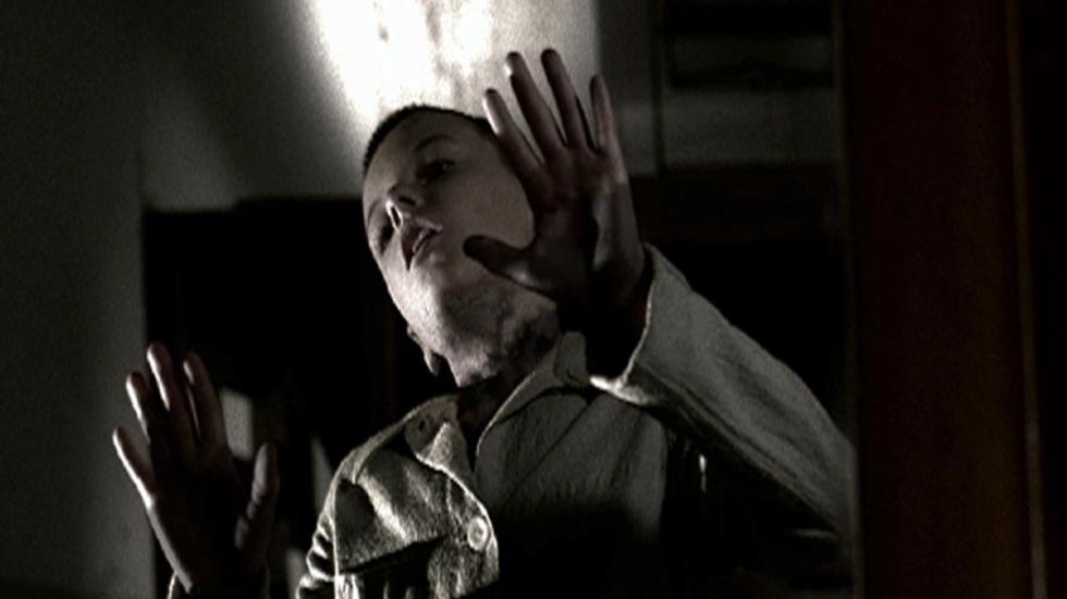Shadow Within woman with hands up