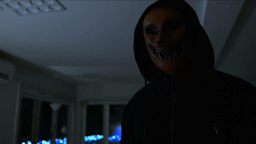 No Caller I.D. film still masked man with a hoodie