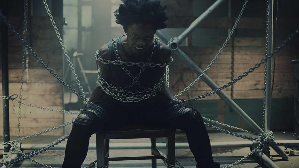 She Never Died film still woman chained up in chair.