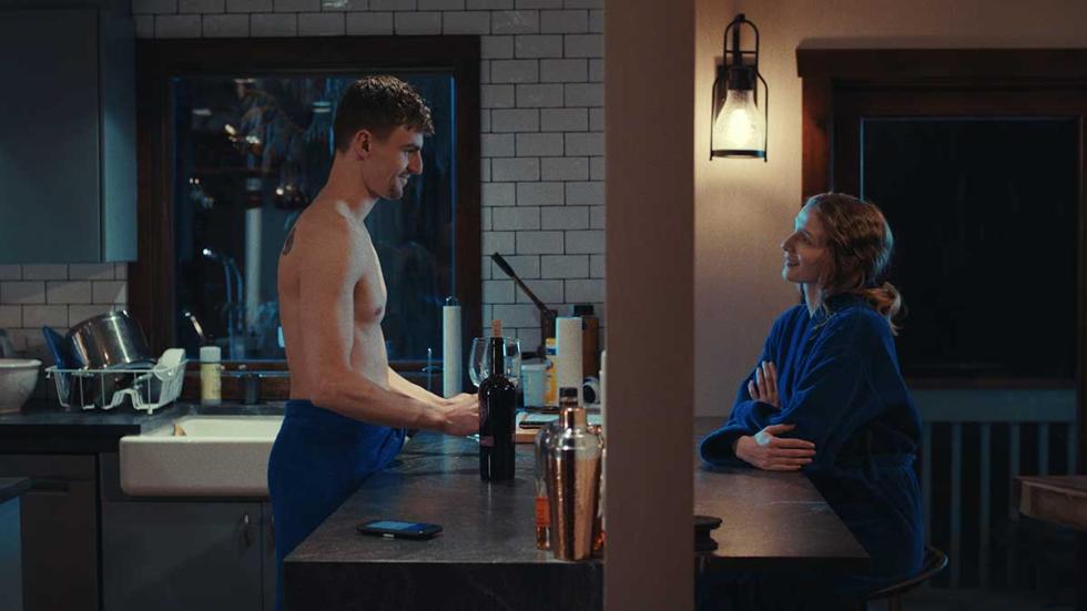 Axe to the Face film still shirtless man talking to a woman