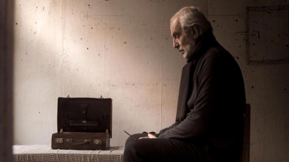 Out of the Darkness film still man listens to a walkie talkie