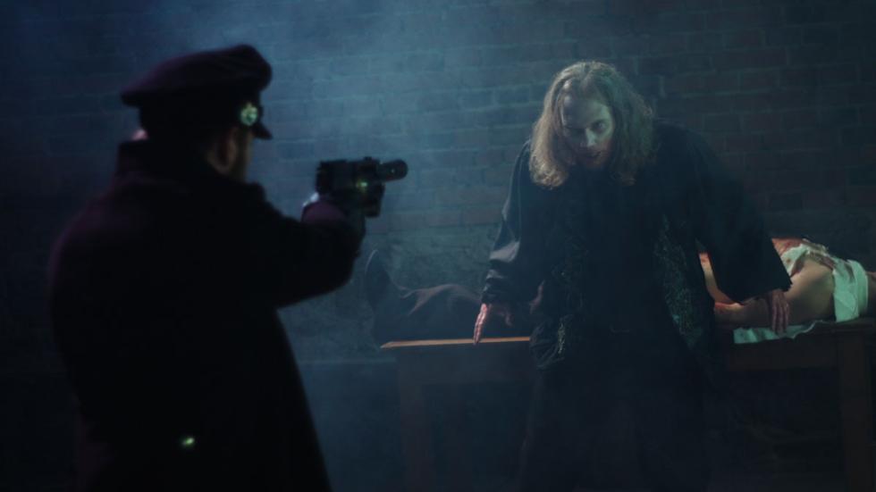 Slayer film still man shoots at vampire