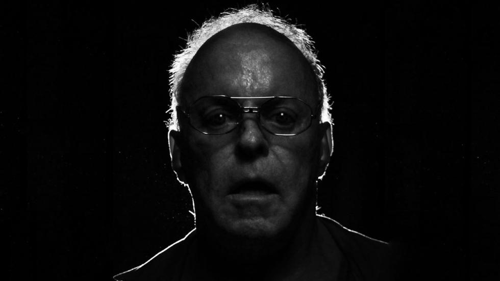Slumlord creepy man with glasses looks straight on