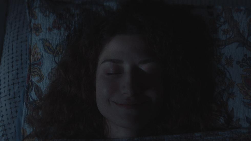Smile film still woman sleeping with smile on her face