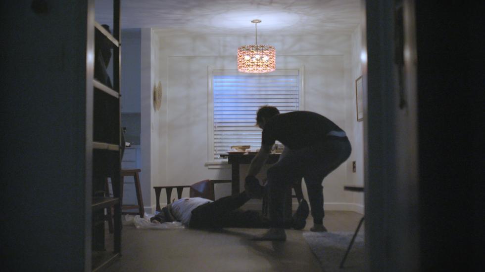 Some Thing film still man dragging body