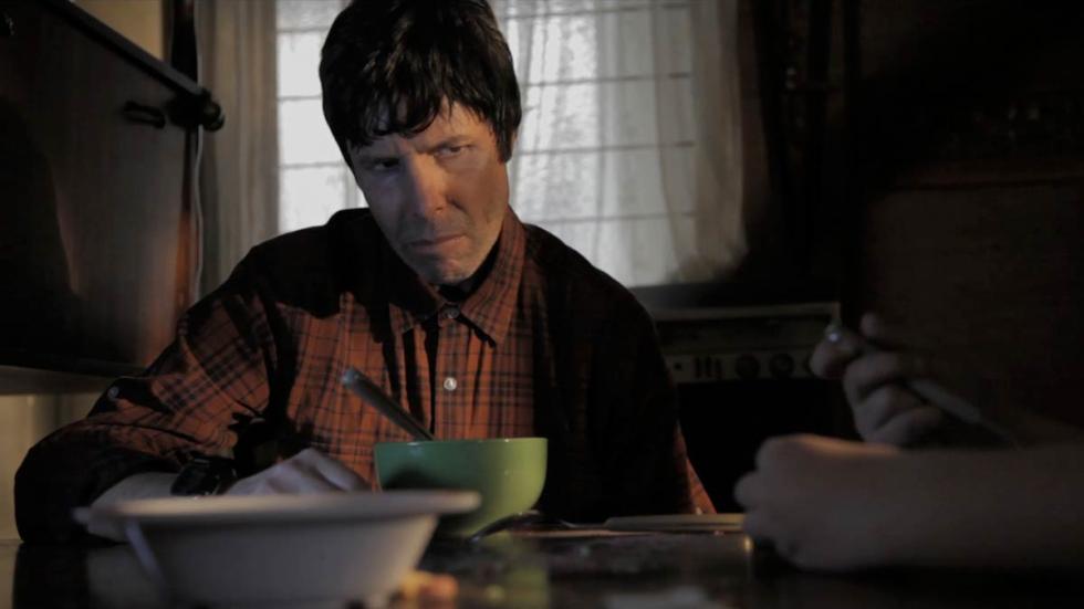La Piedad creepy father looks at his daughter as she eats cereal