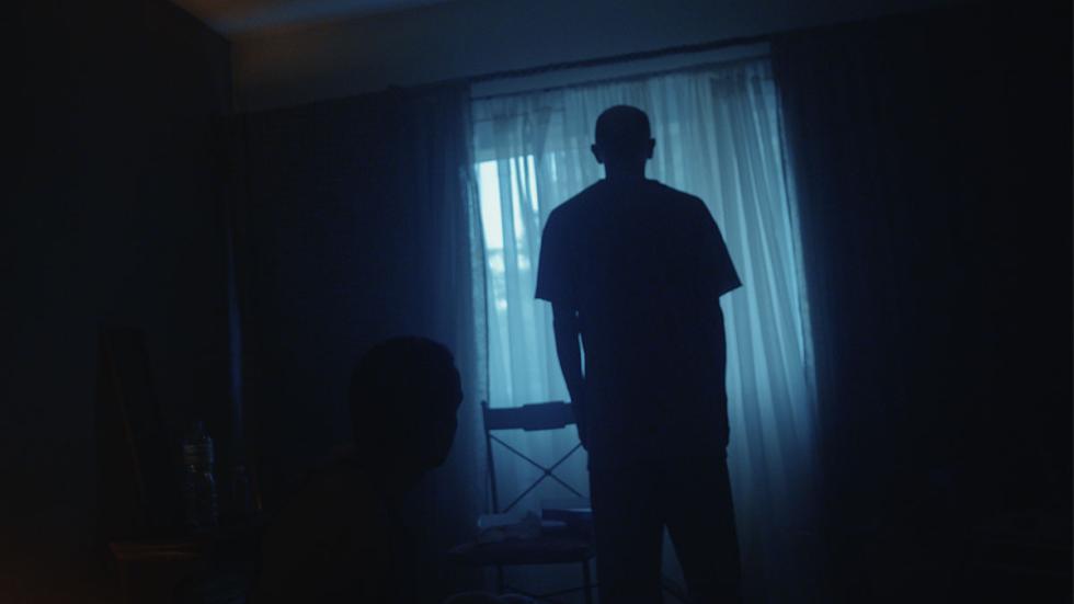 The Collector film still man standing in the dark