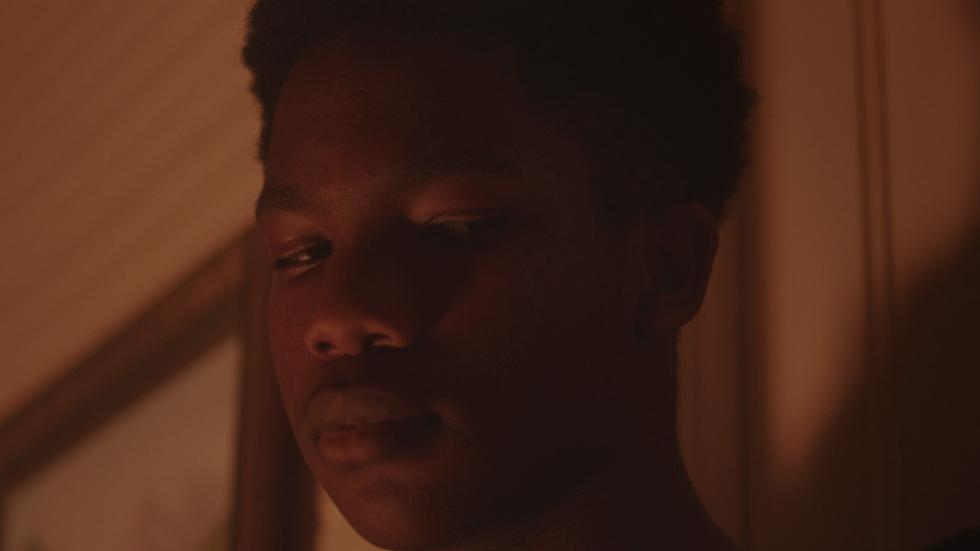 Wolves film still of a young black man's face