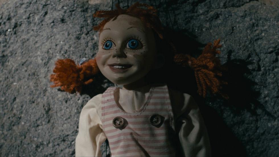A doll with pigtails looking up