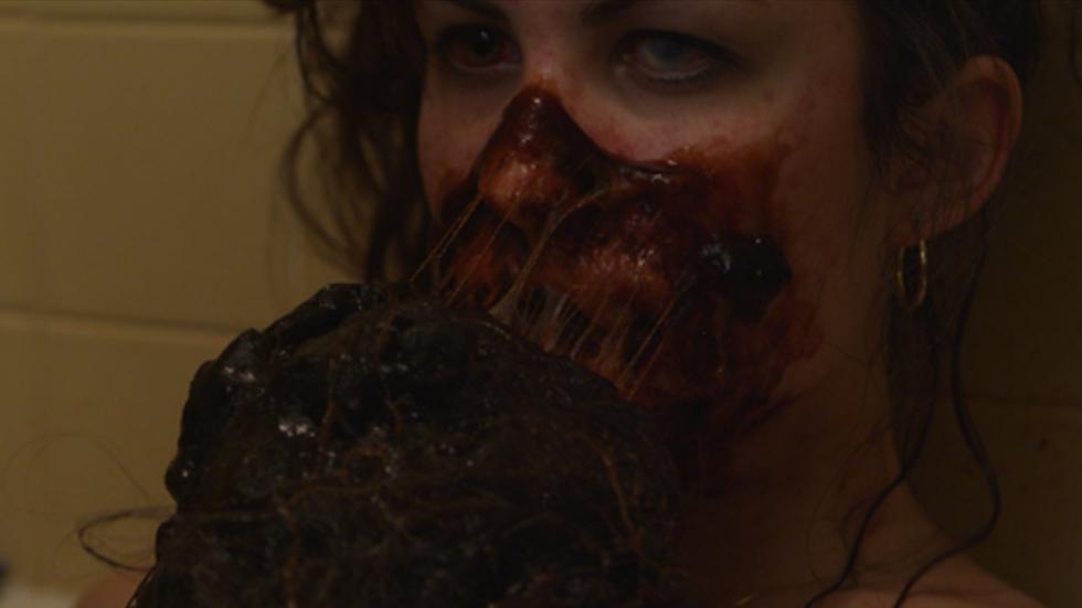 The Muck Woman's face covered with muck