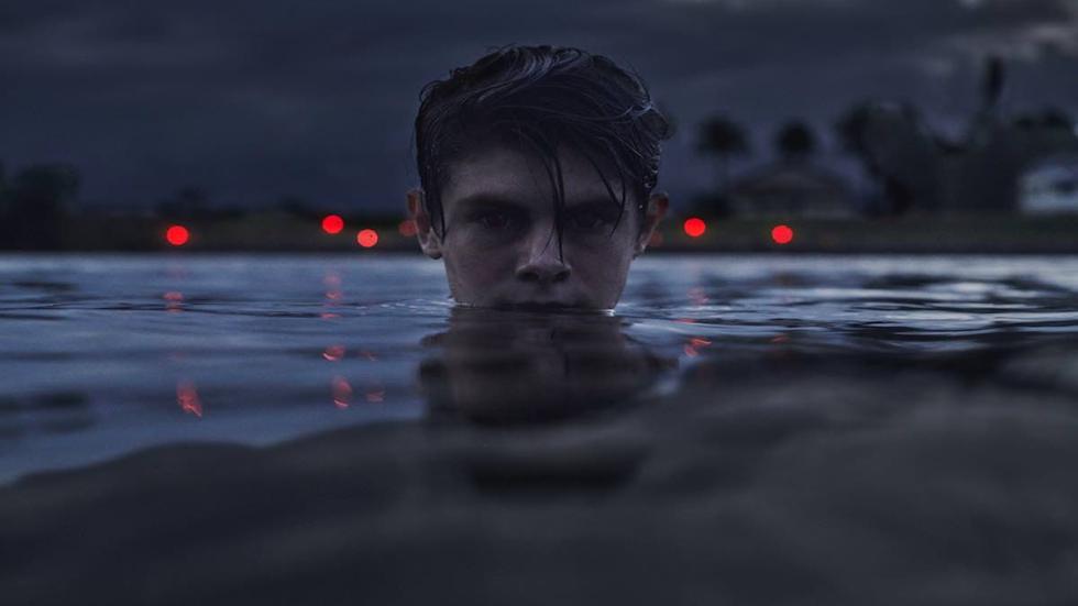 Sweet River film still young man in the water