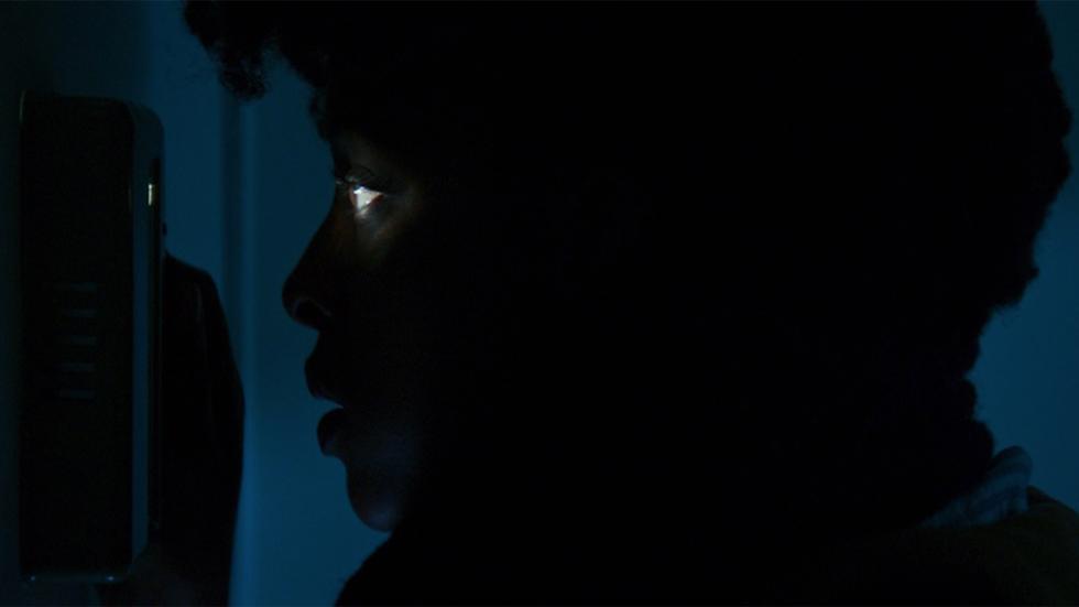 Swipe film still someone in the dark peeping through a door