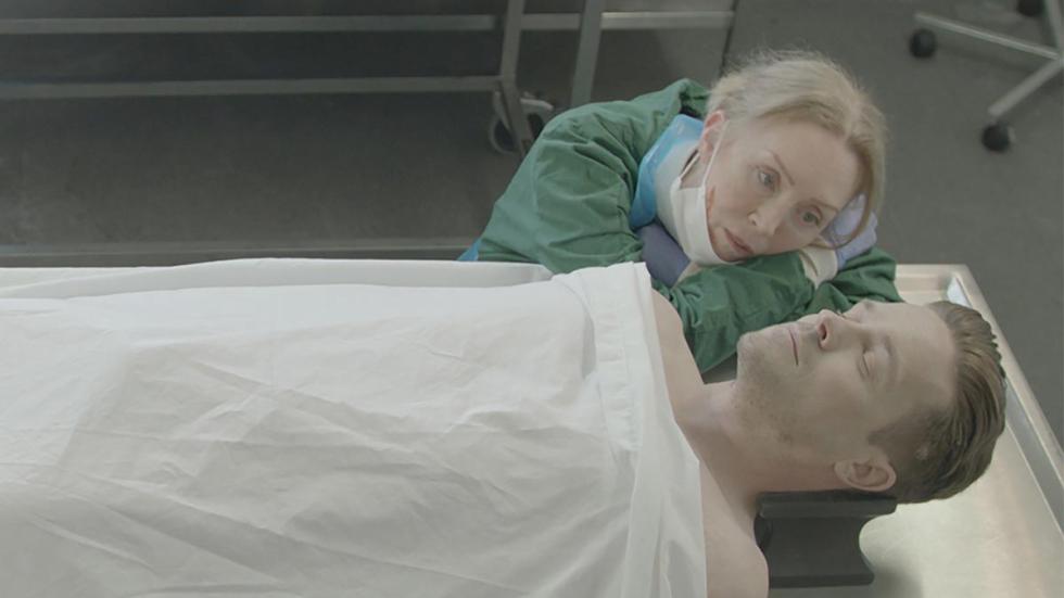 Sybil film still morgue worker looks adoringly at the cadaver.