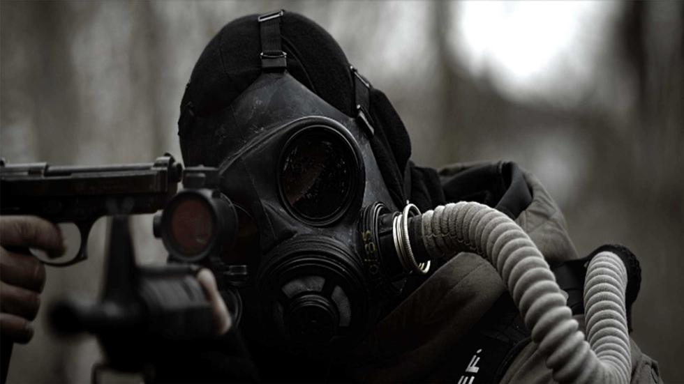 The Rising man in gas mask