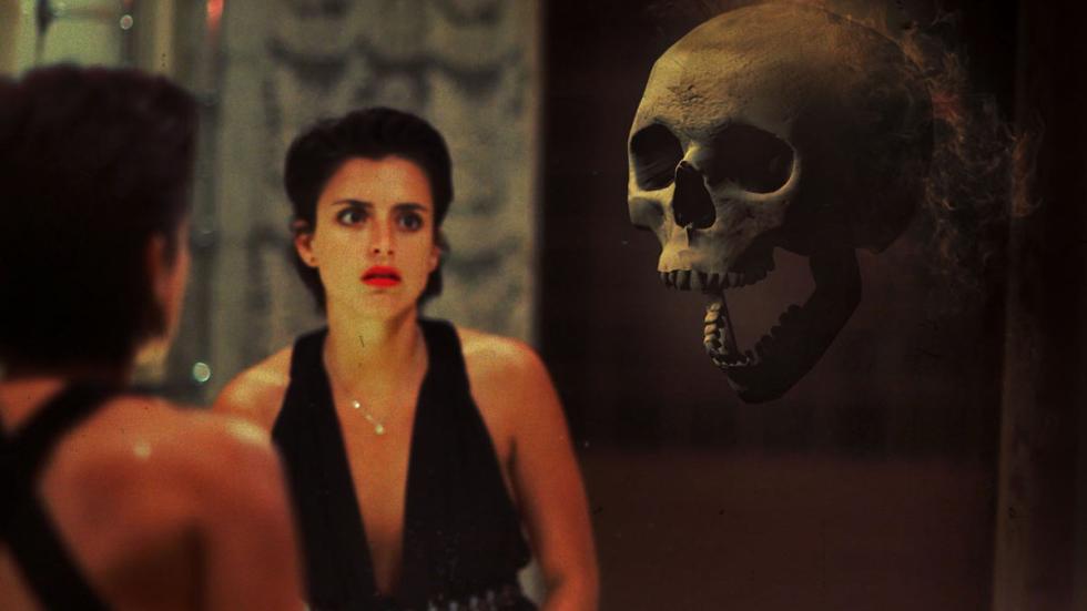 The White Face woman looks in mirror