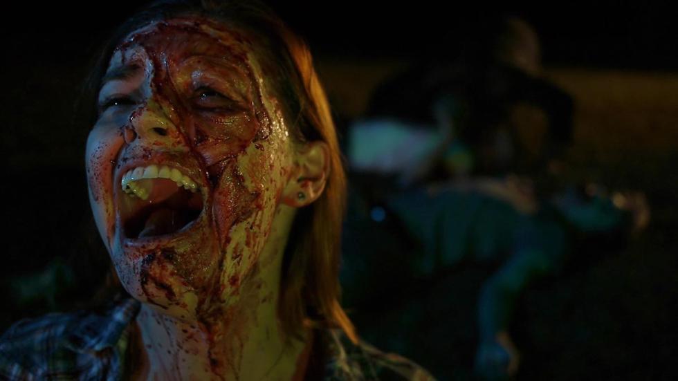 The Demon's Rook woman covered in blood screams