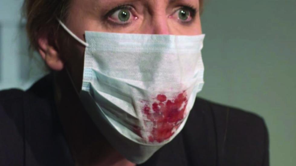 woman with bloody covid mask