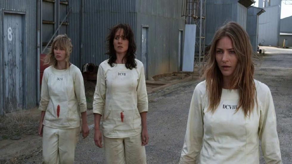 THE  CLINIC women walking outside of industrial building