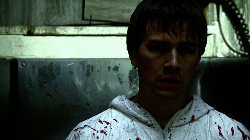 The Familiar man covered in blood splatter